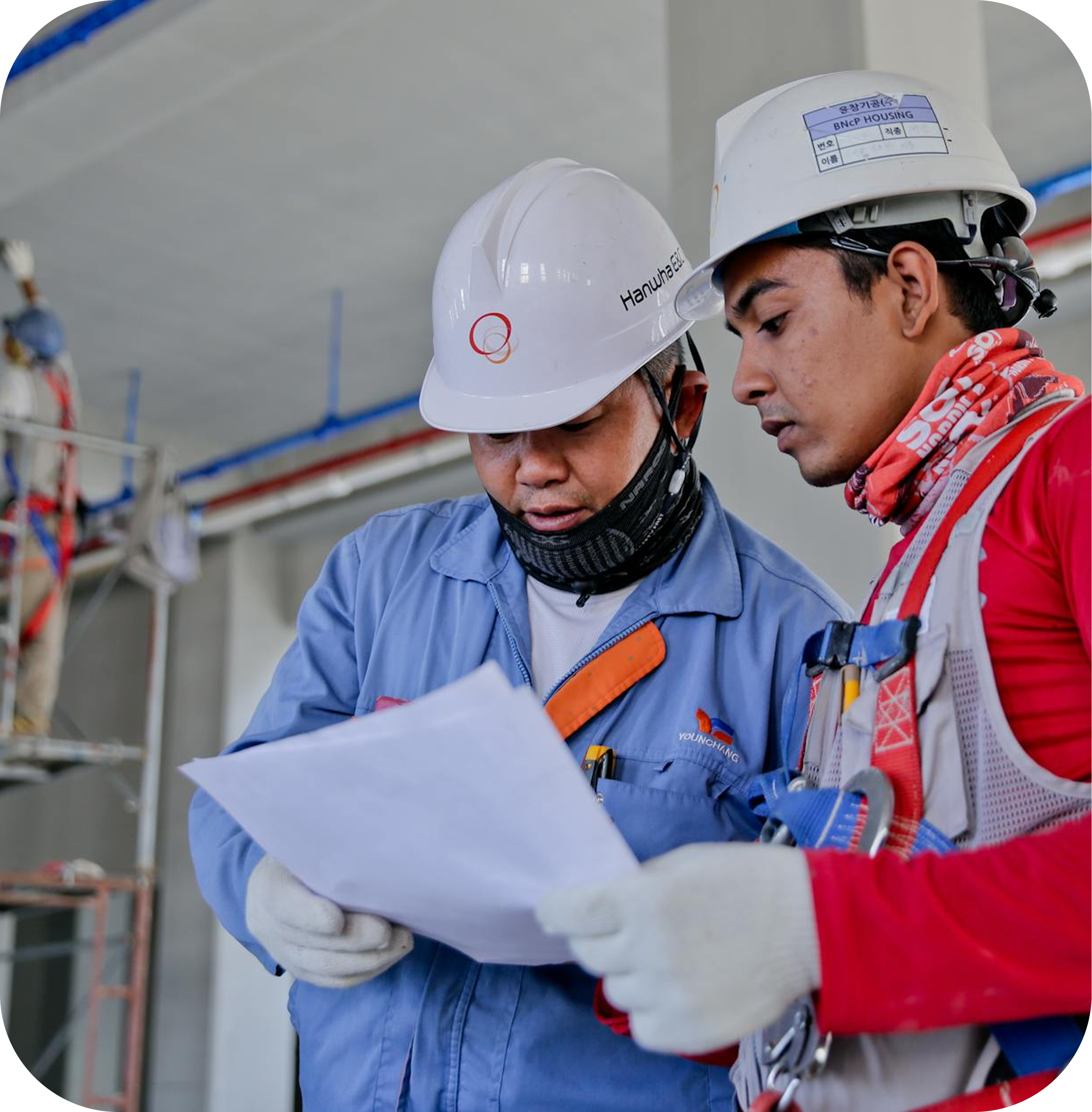Construction workers reviewing documents